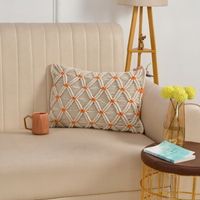 Macrame Cushion cover with orange accents